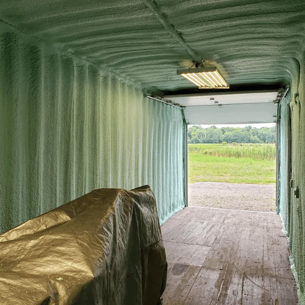Shipping container with spray foam insulation.