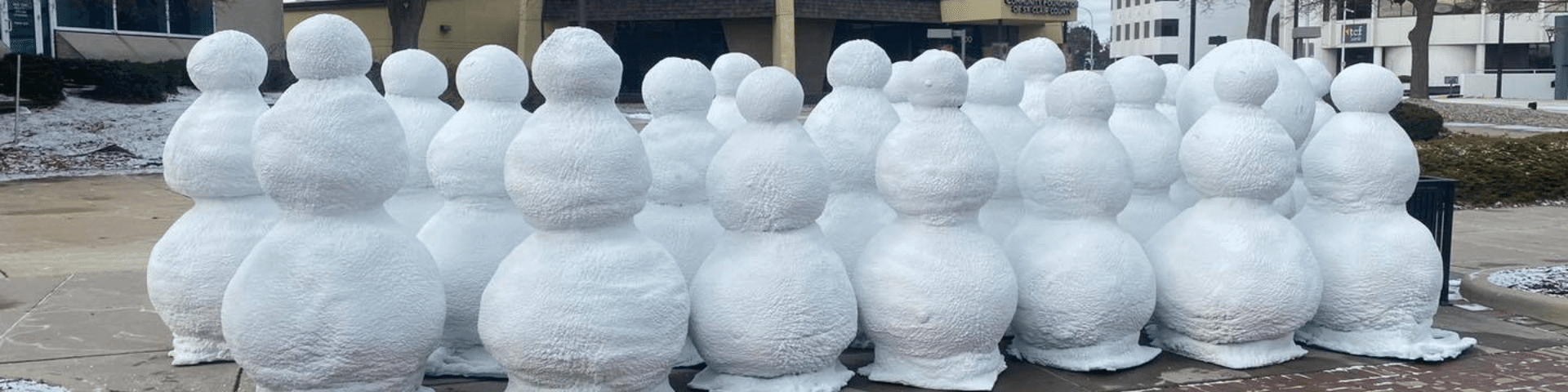 Snowmen made out of spray foam.